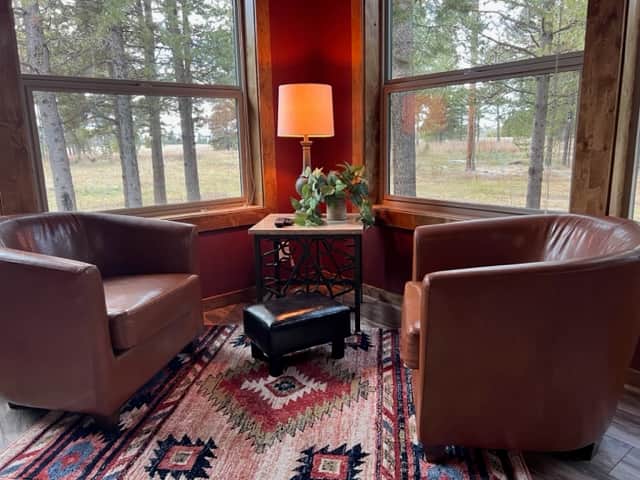 A corner nook. The perfect place for morning coffee. Turn the chairs for nature watching. A corner nook. The perfect place for morning coffee. Turn the chairs for nature watching.