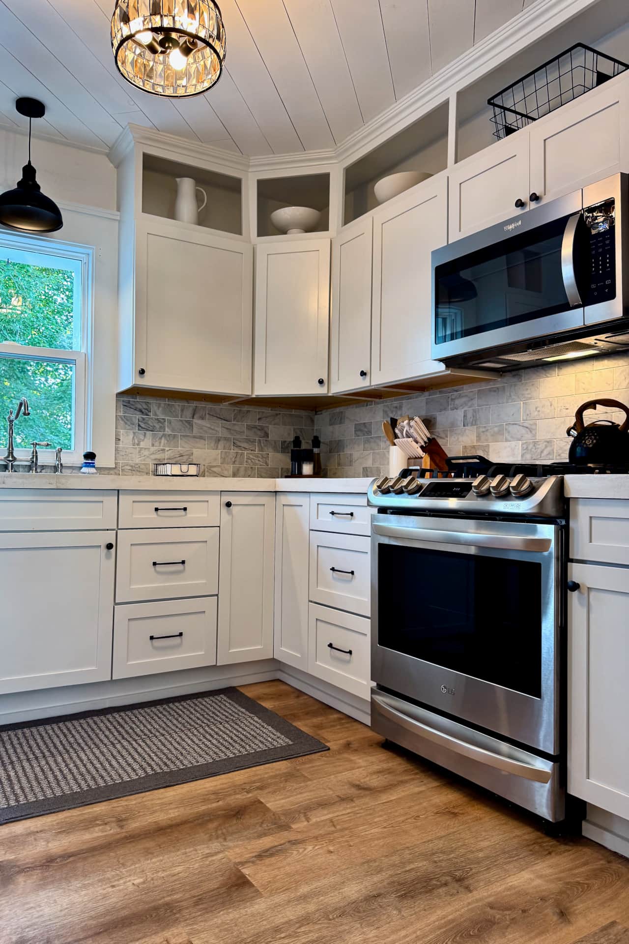 Fully stocked remodeled kitchen with an LG gas range and plenty of prep space.
