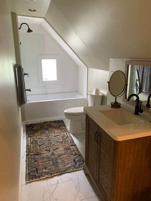 Beautiful full bathroom with tiled shower. Beautiful full bathroom with tiled shower.