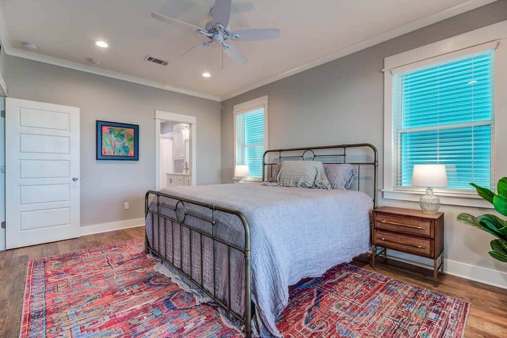 Master bedroom with king size bed and en suite bathroom with large walk in closet