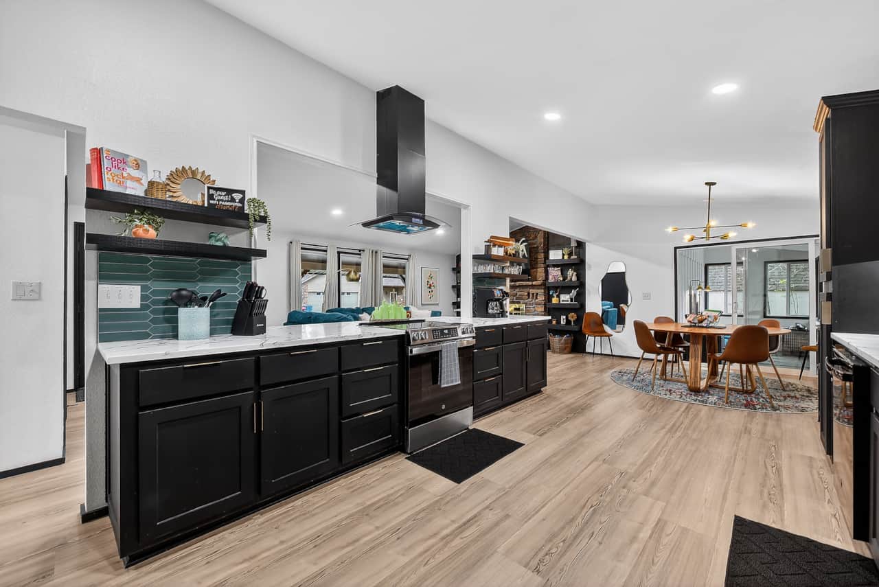 Bright kitchen with modern appliances, generous counter space, and a convenient coffee bar.