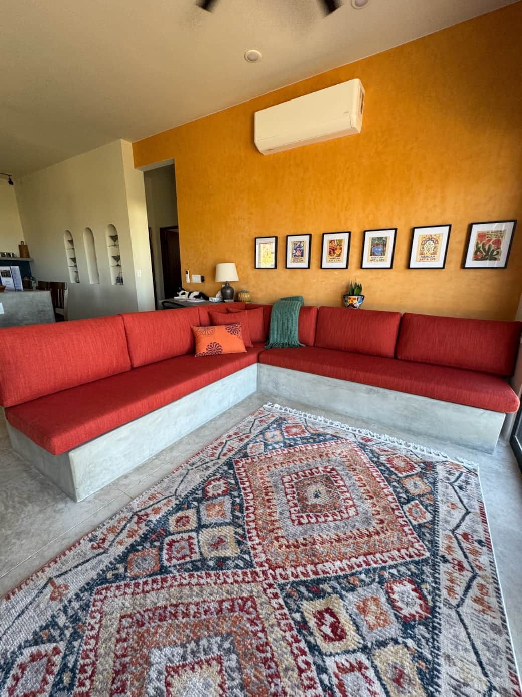 The open layout between the living room and kitchen creates a spacious feel, with luxurious cushions The open layout between the living room and kitchen creates a spacious feel, with luxurious cushions