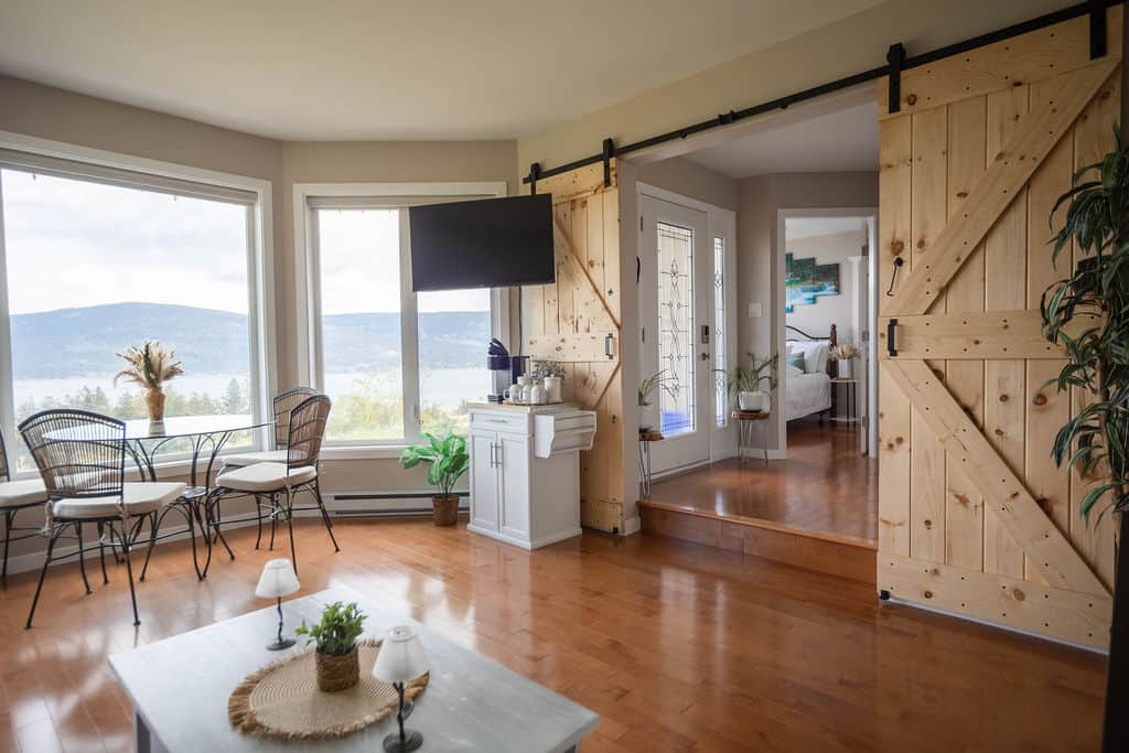 Bright Living Area with Dining Nook and Lake Views Bright Living Area with Dining Nook and Lake Views