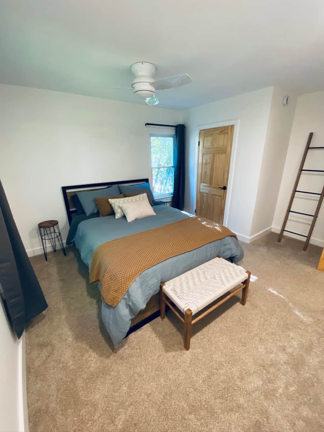 One of two main floor bedrooms with a queen size bed and plenty of closet space