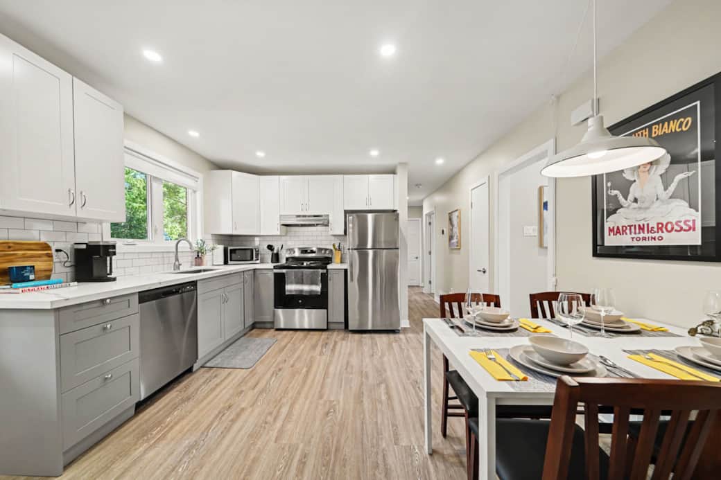Fully equipped modern kitchen featuring stainless appliances and ample counter space. Fully equipped modern kitchen featuring stainless appliances and ample counter space.