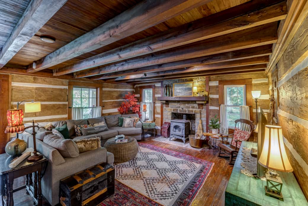 Spacious great room surrounds the stone fireplace with comfortable gathering space