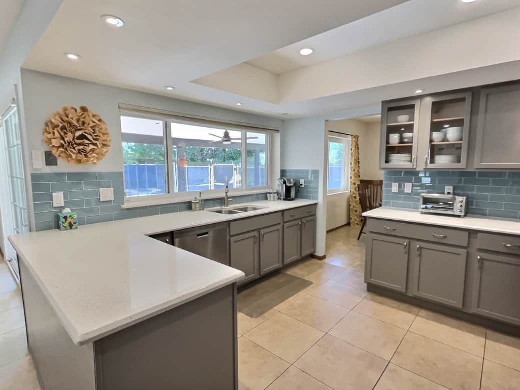 Kitchen overlooking the pool and yard