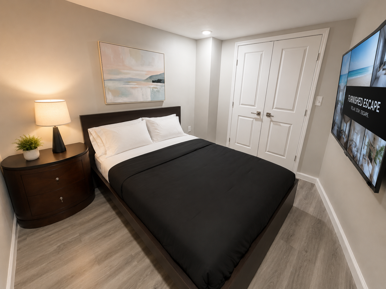 Bedroom 2: Comfortable, stylish bedroom featuring a queen-size bed, crisp bedding, warm bedside lighting, and a wall-mounted Smart TV with Roku. The room also offers a large closet with plenty of storage space, modern flooring, and relaxing décor—perfect for a comfortable stay.