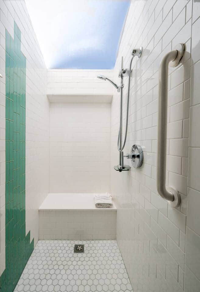 The walk-in shower has a glass ceiling, so it’s light and bright