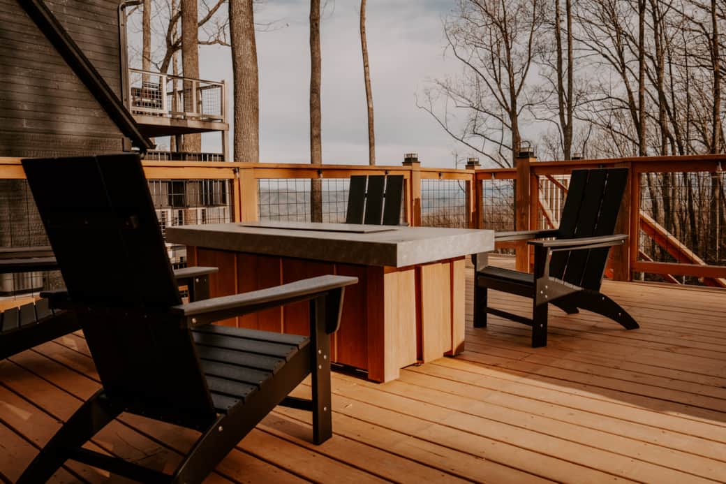 Cozy back deck with outdoor fireplace, comfortable seating, and Smoky Mountain views Cozy back deck with outdoor fireplace, comfortable seating, and Smoky Mountain views