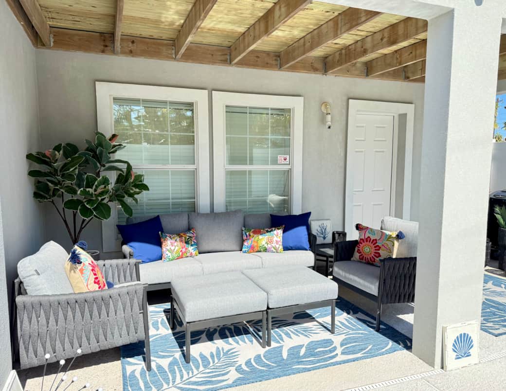 Relax with a cup of coffee or glass of wine on the covered patio Relax with a cup of coffee or glass of wine on the covered patio