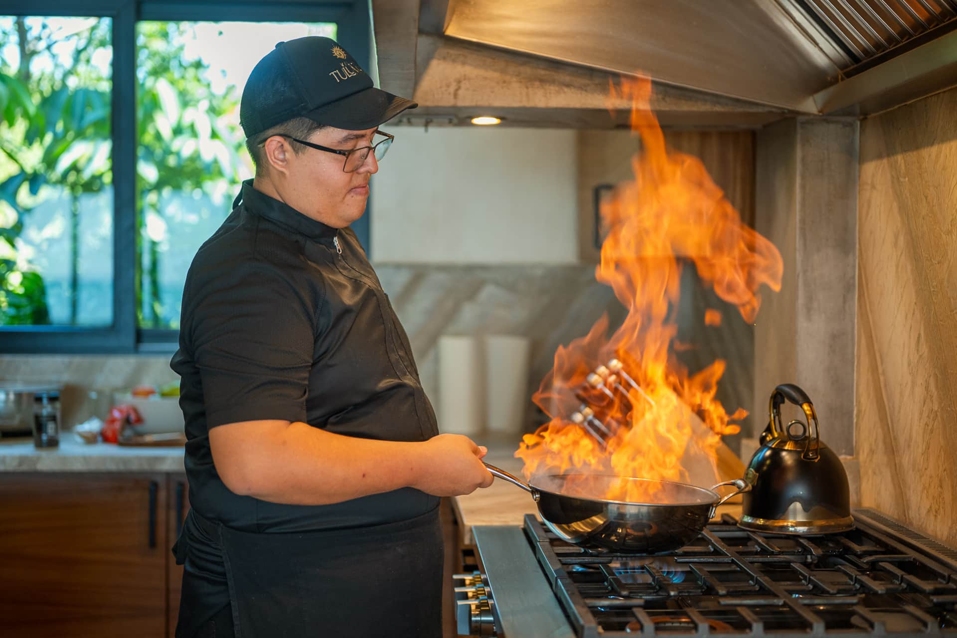 Chef flambéing cuisine at Villa TuluMar