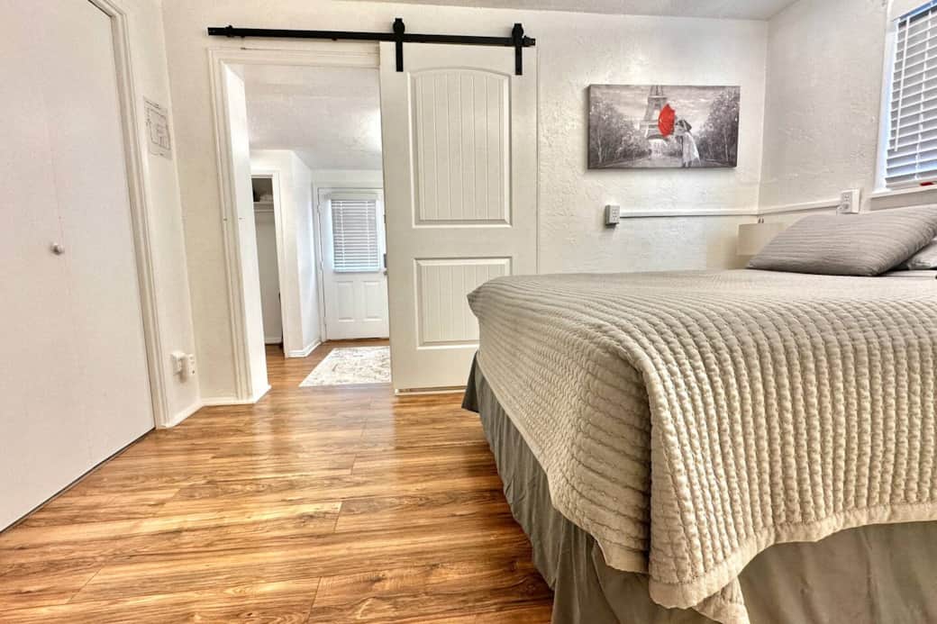 The second bedroom with sliding door to the first bedroom shown