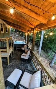 Soak in the hot tub or lounge on the comfy porch furniture on the back deck. 