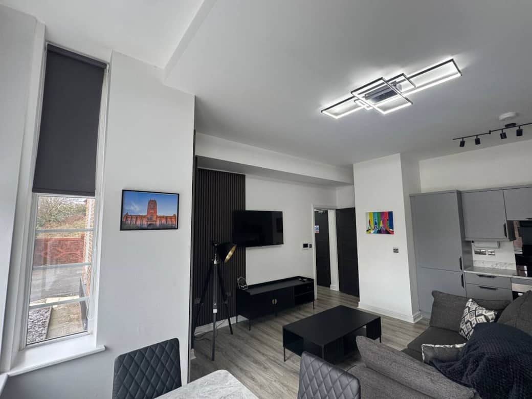 living area with sofa, dining area and smart tv