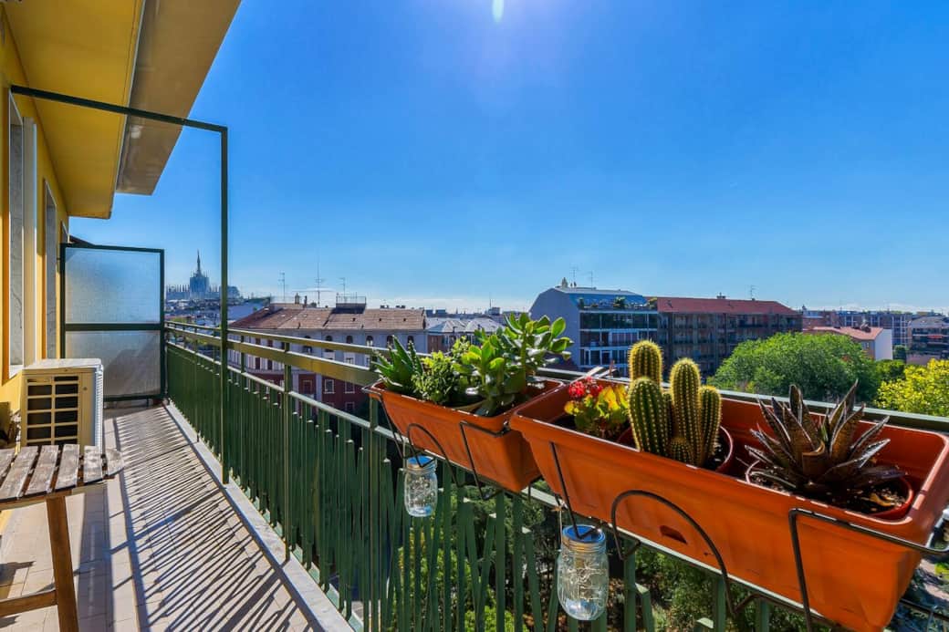 Wide balcony overlooking the rooftops of Milan and the green of Piazza Napoli Wide balcony overlooking the rooftops of Milan and the green of Piazza Napoli