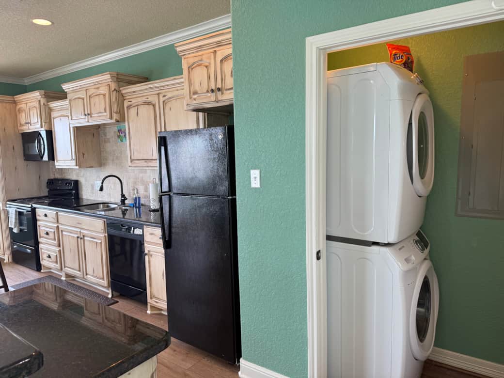 The washer and dryer is just off the kitchen. The washer and dryer is just off the kitchen.