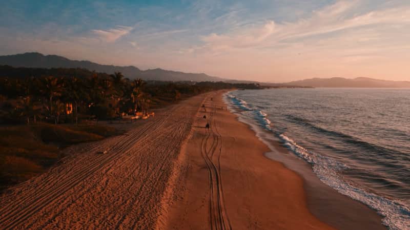 Long uncrowded beach at sunset near La Peñita de Jaltemba, Riviera Nayarit
