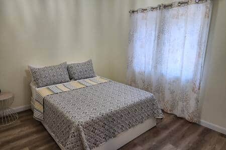 Hemlock Hideaway.  Queen sized bed plus a separate twin bed, view of forest 