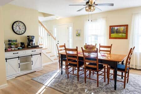 The dining room and coffee station are open to the kitchen.