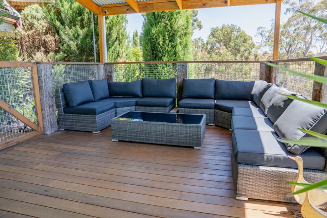 The pool deck lounge - under the pergola roof
