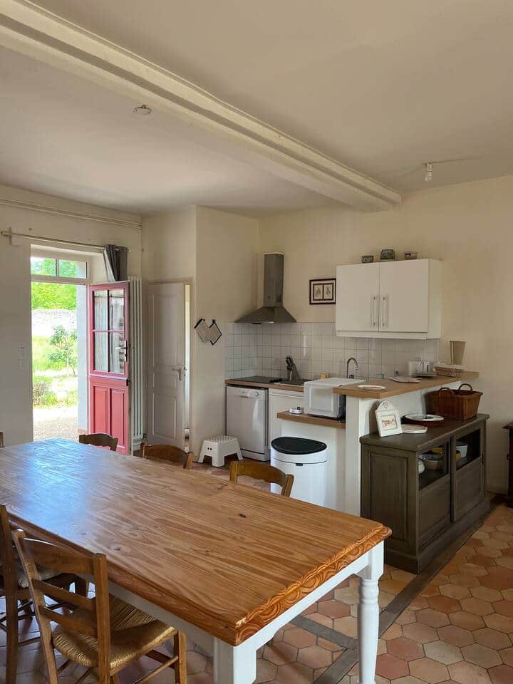 Kitchen looks out to large meadow 