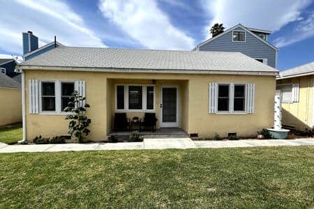 View of front of house.  House is up drive way and off the street.  