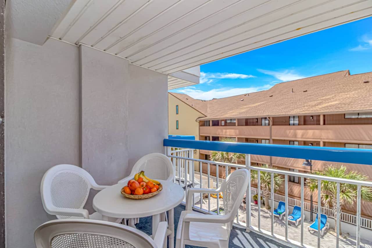 Sip coffee or wine with a view and fresh ocean air, just steps from the pool.