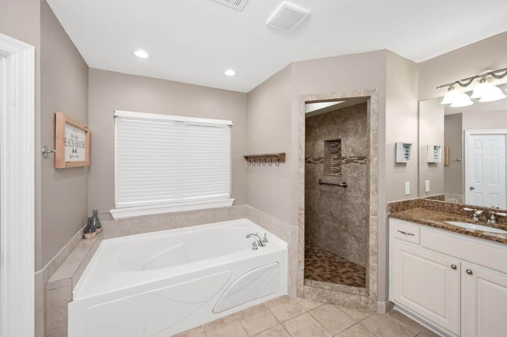 Another view of Master Bedroom Bathroom with His/Her sinks, jacuzzi tub, walk in shower, and private toilet room.  