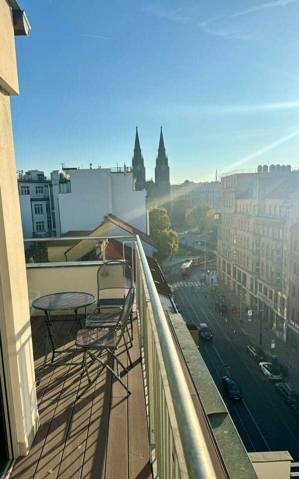 Terrace overlooking Vinohrady and the classic trams.