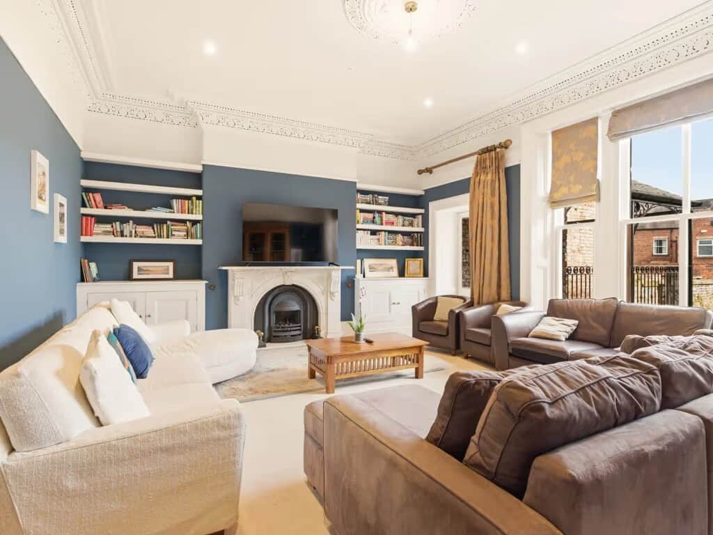 Spacious and elegant living room with comfortable seating, perfect for relaxing and gathering with family and friends