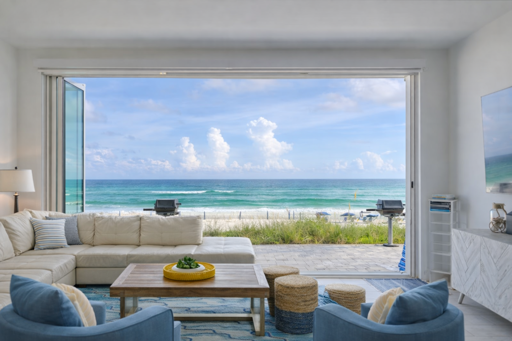 Destin Retreat living room opens up to the private beach and Gulf views.