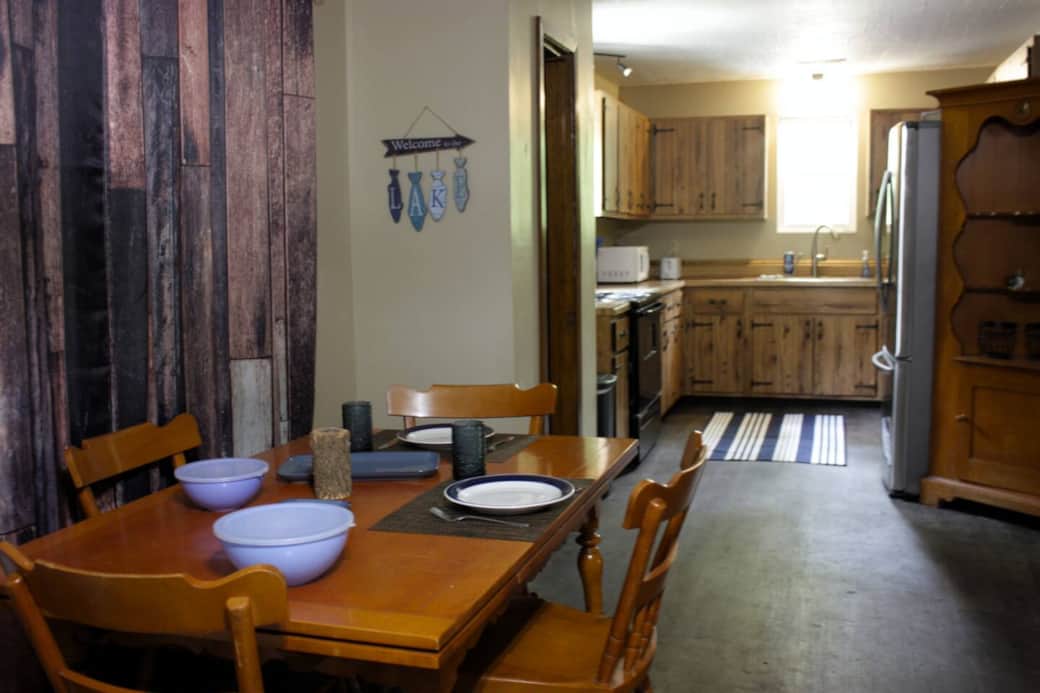 Stocked with dishes, silverware, cooking utensils and pots and pans