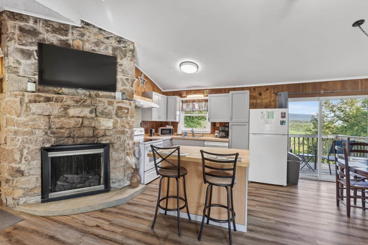 Gather around the impressive stone fireplace after a day of hiking, kayaking, or exploring the area.