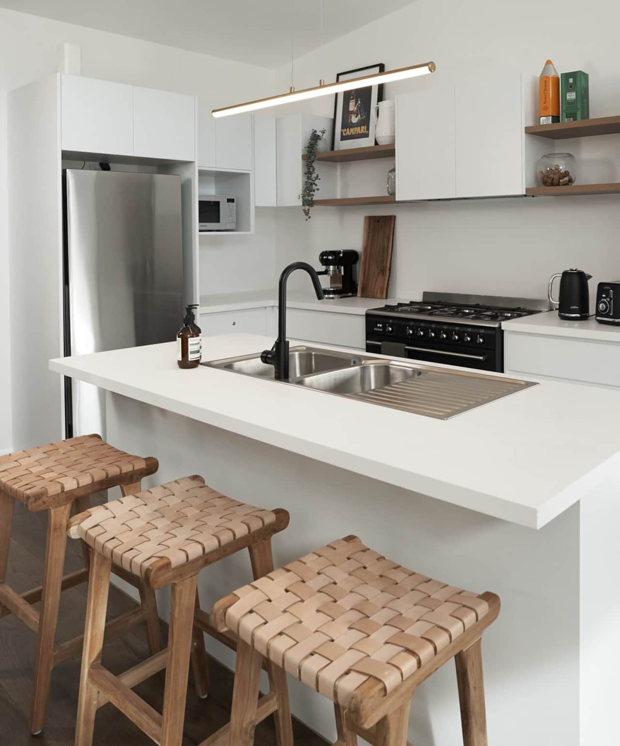 Luxurious open plan kitchen with designer appliances including a 900mm Smeg oven. 
