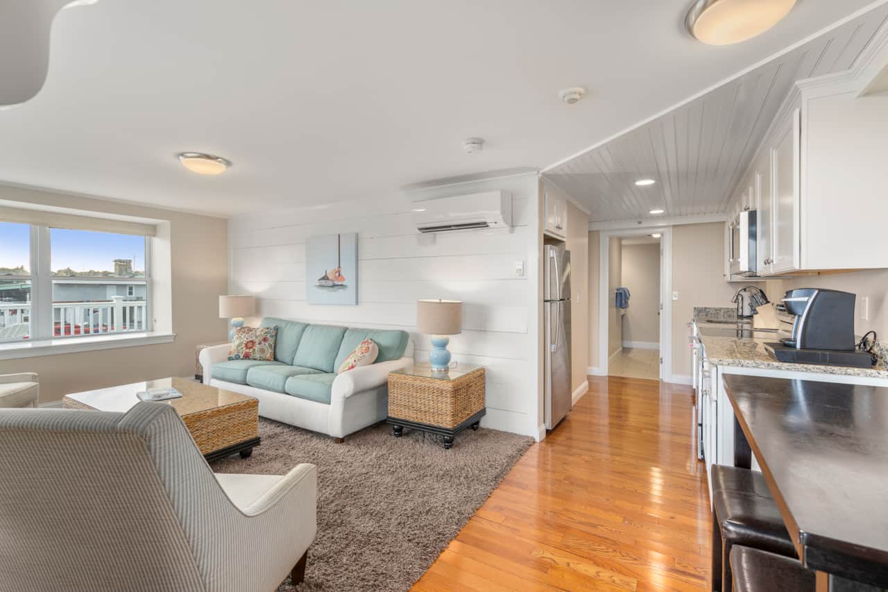 Living Room With All The Views. Watch boats come and go from your couch!