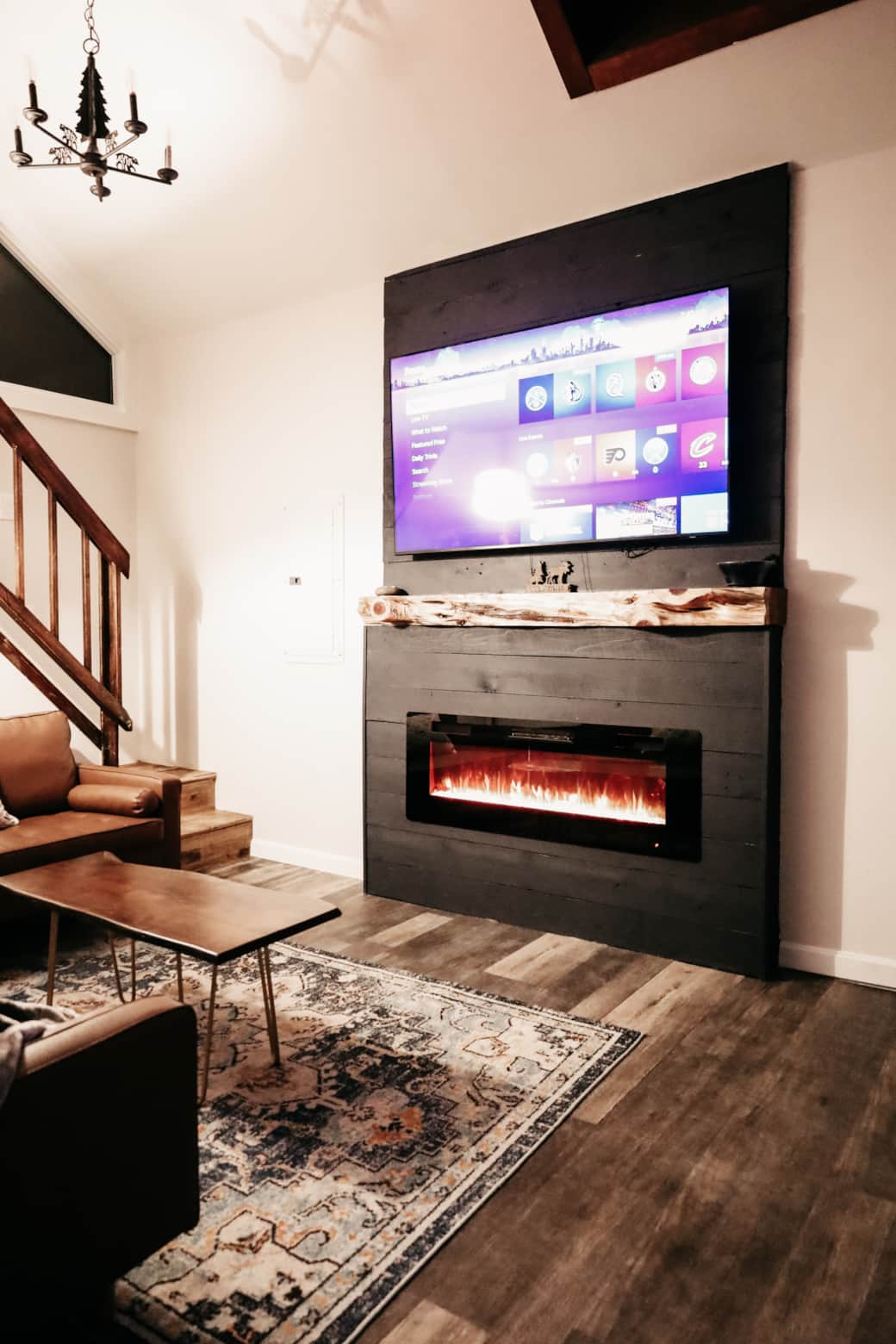 Cozy living room with fireplace, large TV, and comfy seating, perfect after a day in the mountains Cozy living room with fireplace, large TV, and comfy seating, perfect after a day in the mountains