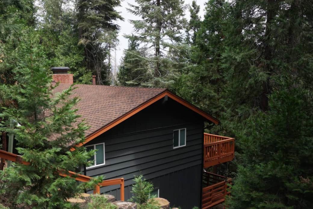 Tranquil cabin nestled in the woods.