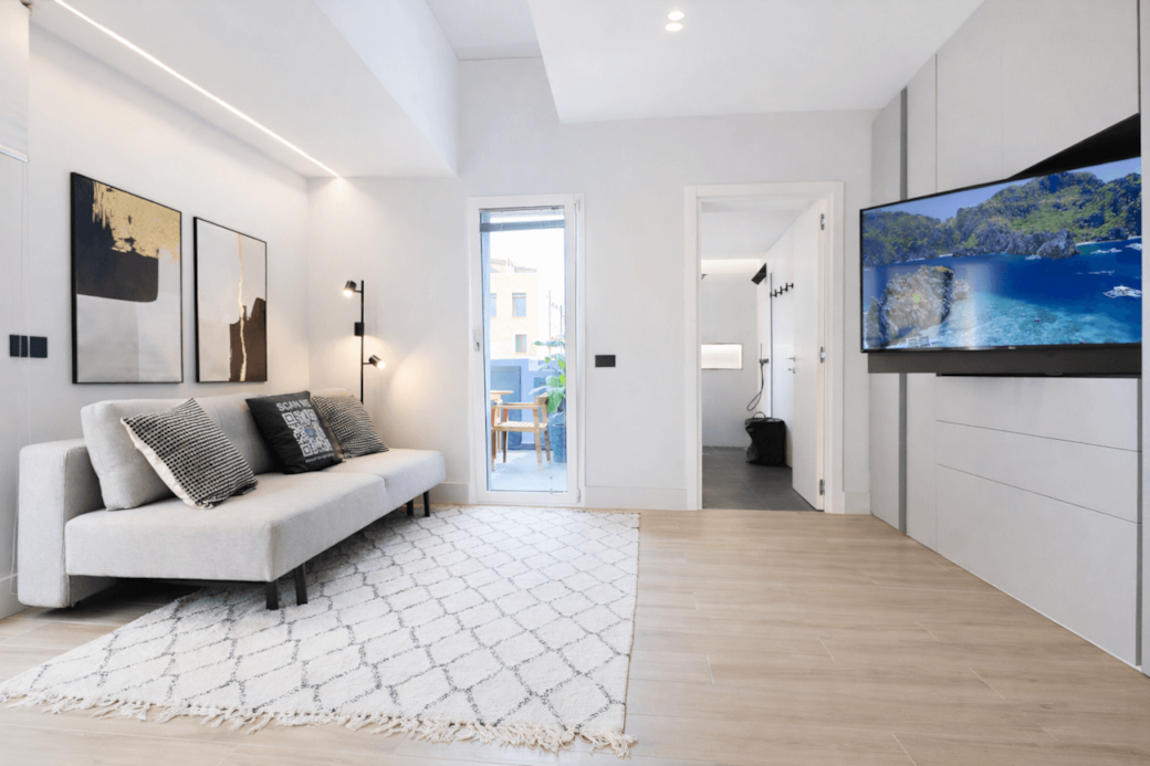 Via-garibaldi-4- R E N T A L12- Olbia-penthouse-living-room-terrace-access-hero