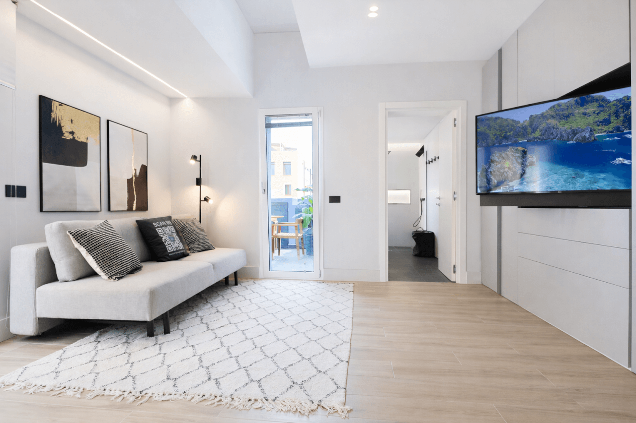 Via-garibaldi-4- R E N T A L12- Olbia-penthouse-living-room-terrace-access-hero