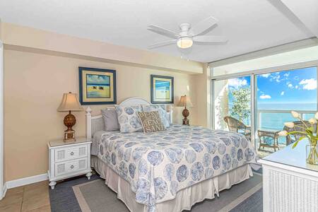 Spacious master bedroom w/ stunning ocean views, balcony, ensuite bathroom and NEW Smart Roku TV!