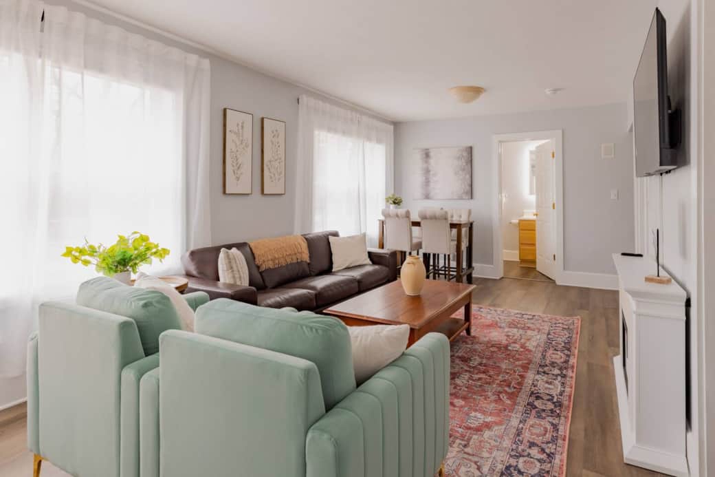 Main living space, dining table and bathroom door