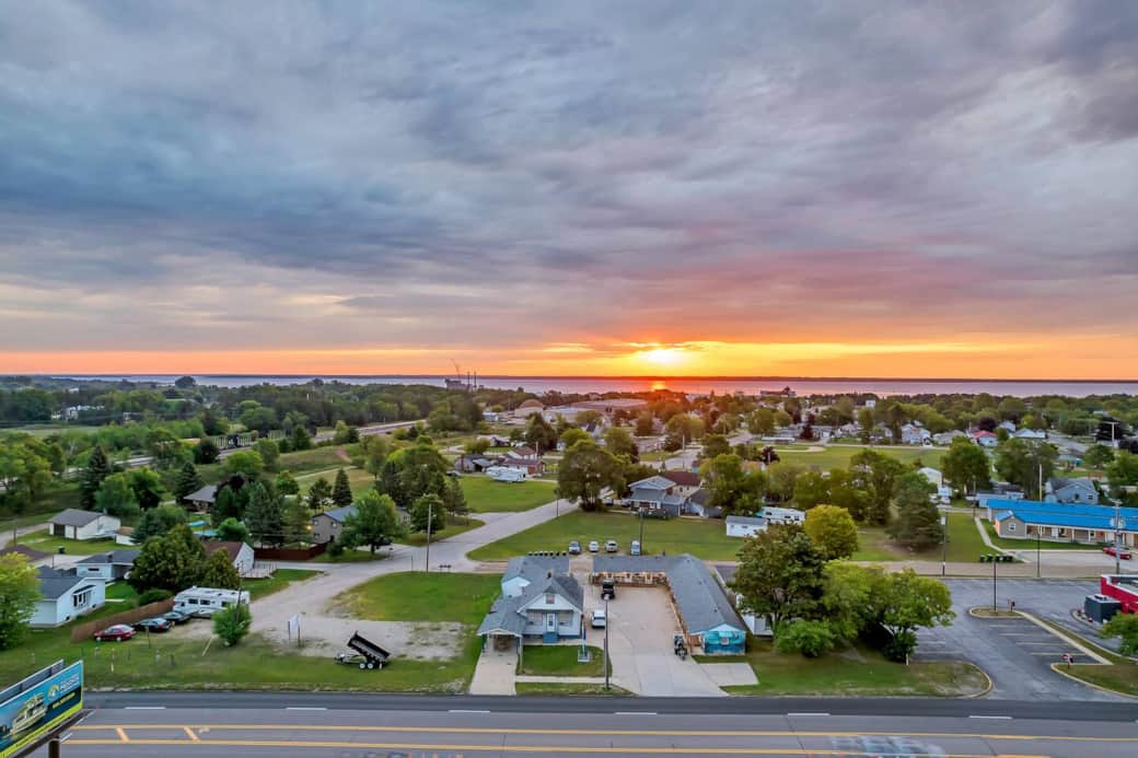 Experience stunning sunsets over a quiet lakeside neighborhood, offering a serene setting just minutes from the shoreline.