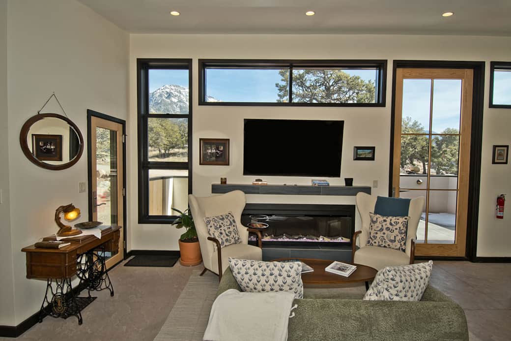 Living Area with Electric Fireplace & Oversized Door to Patio