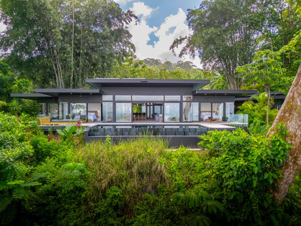 View of back of the Home and infinity edge pool