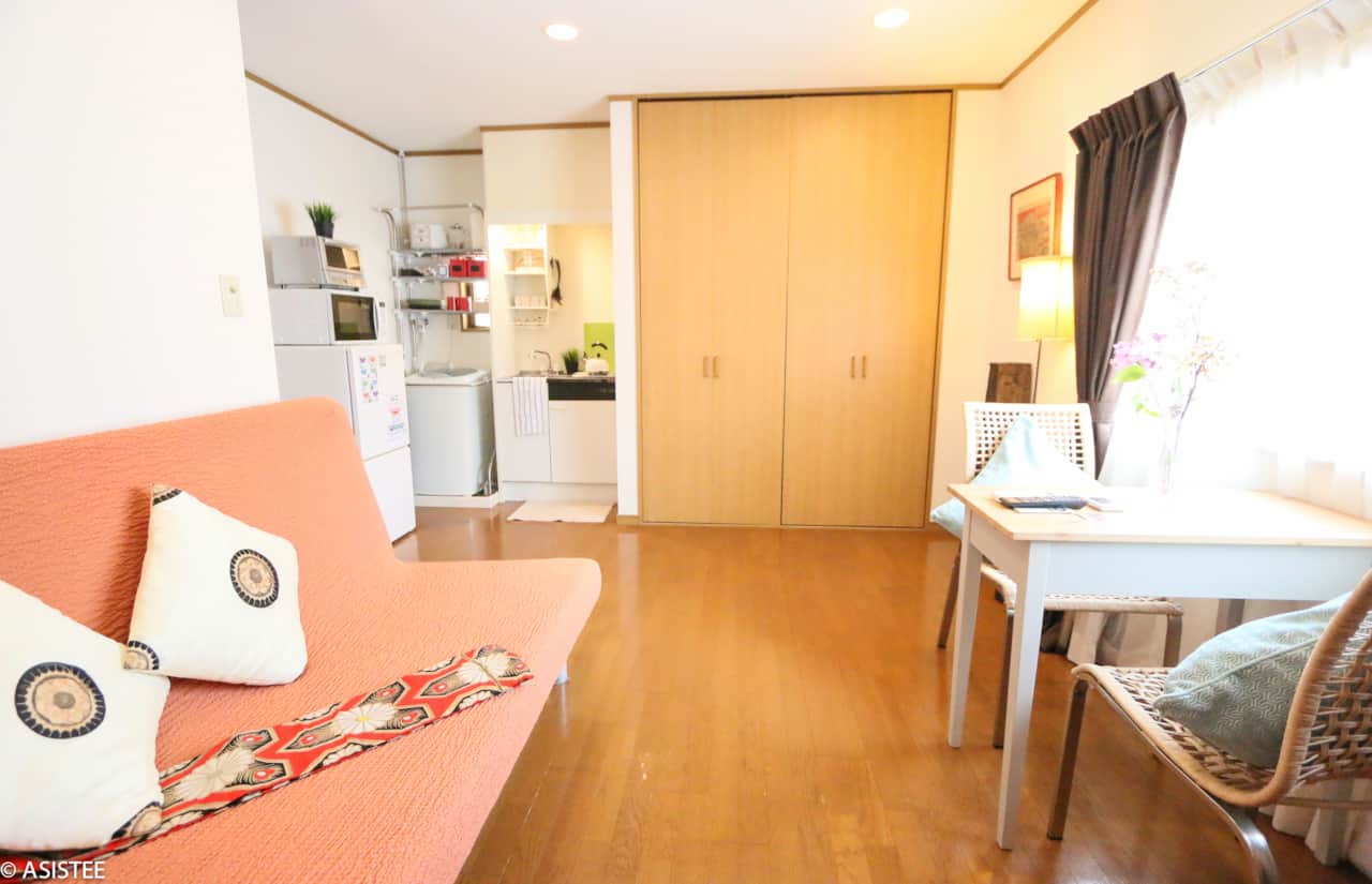 Open-plan design with warm lighting and smart storage solutions enhances comfort and convenience