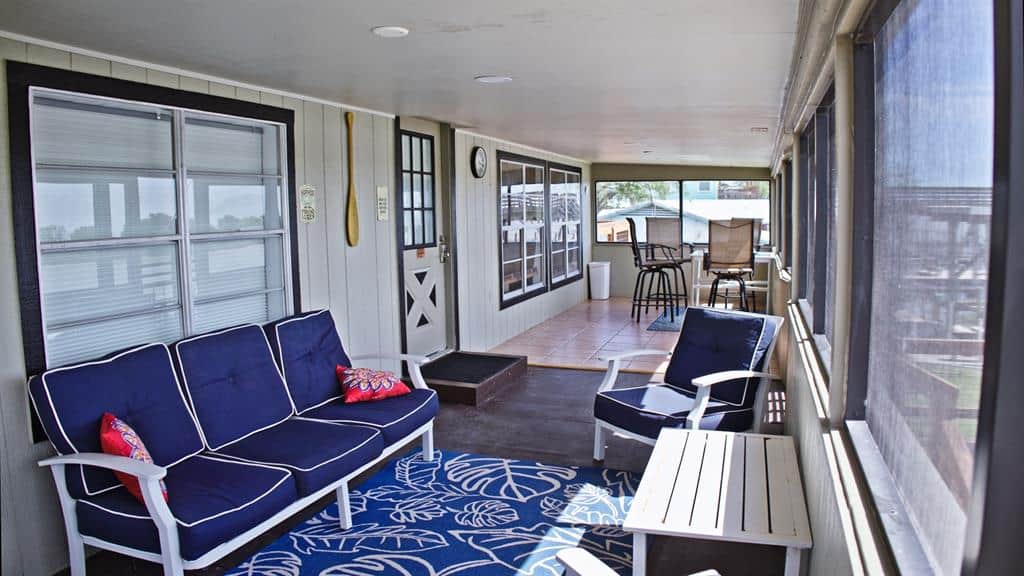 The screened porch overlooks the river. 