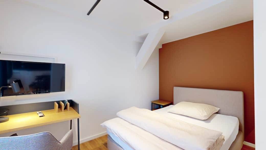 Gemütliches Schlafzimmer mit Doppelbett im N°8A Boardinghouse