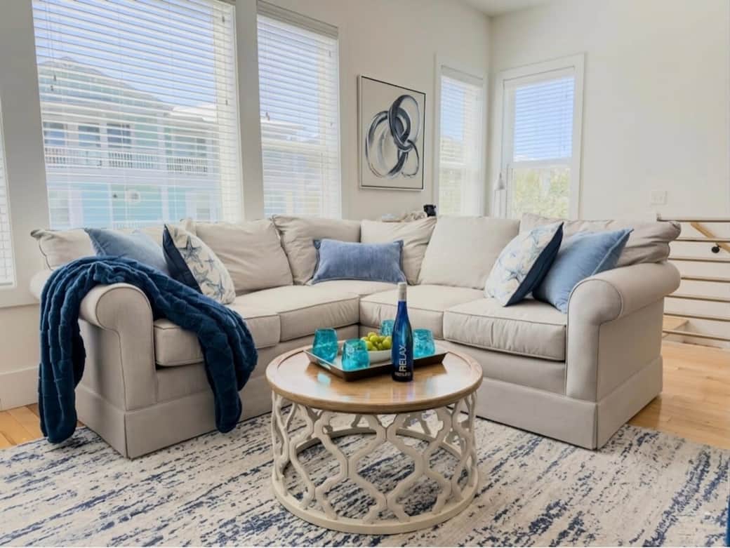 Spacious sectional seating designed for group lounging, game nights, and post-beach relaxation.