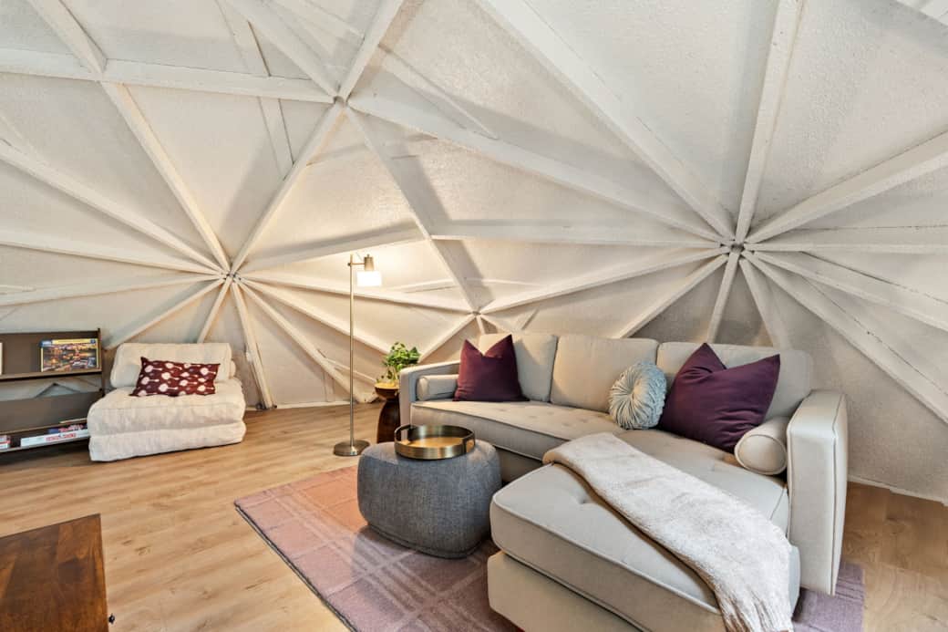 Loft lounge with sectional seating under the one-of-a-kind dome ceiling.